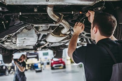 Man servicing a car